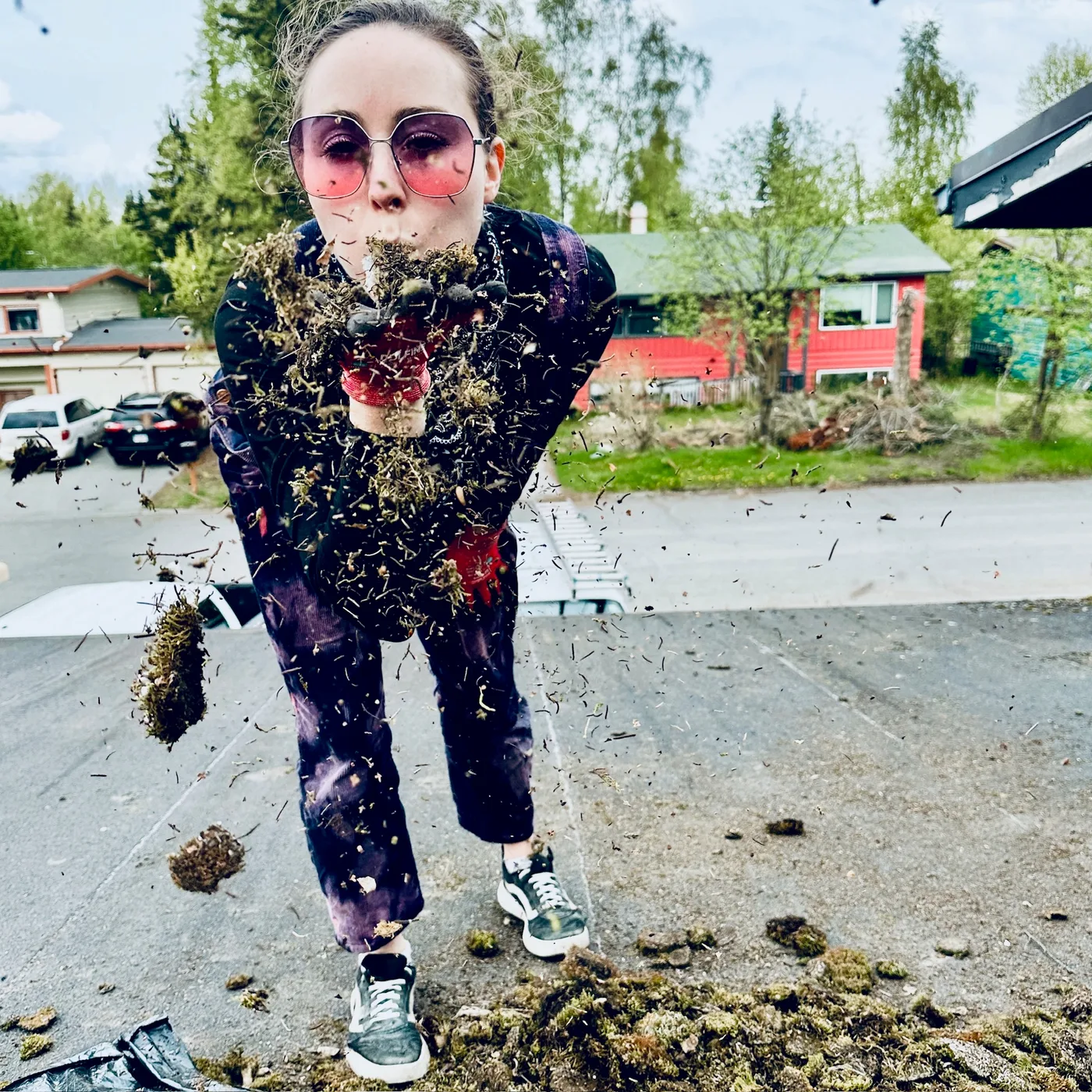 Team member removing roof moss