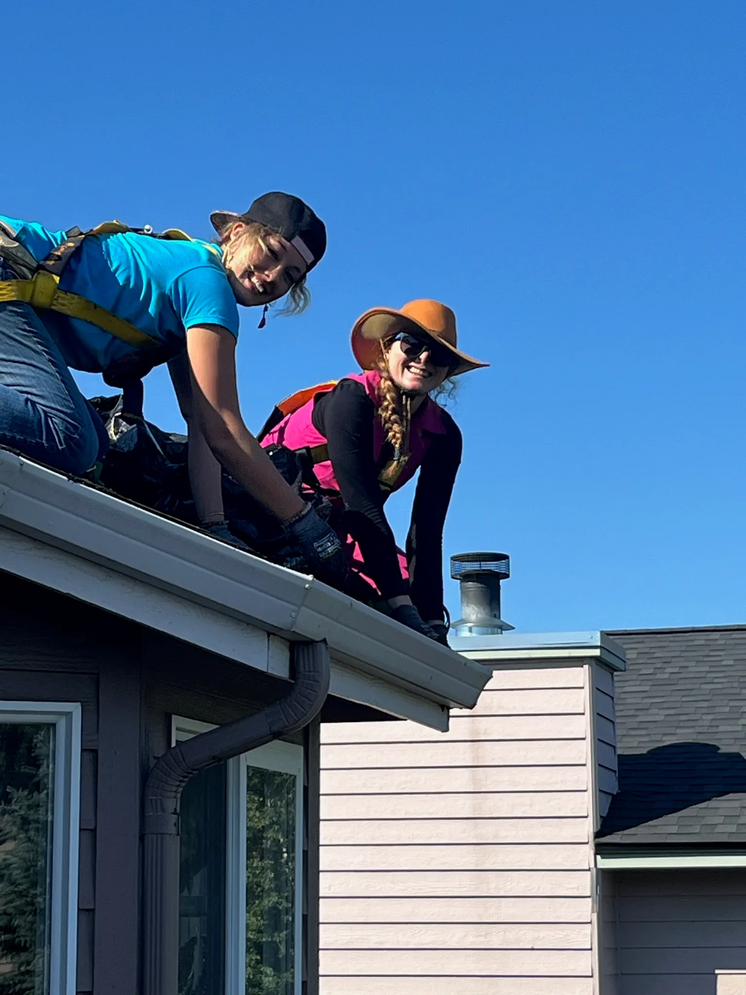 The AK Gutter Gals team on an Anchorage roof